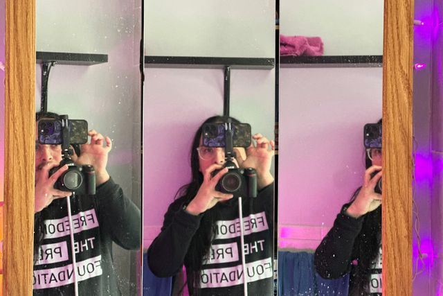 The same photo, but in this one the edges of the mirrors are in focus and there are visible specks of grime on the mirror surface.