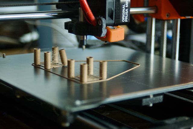 Eight tan cylinders in groups of four similar to the ones above. There is stringing between the cylinders.